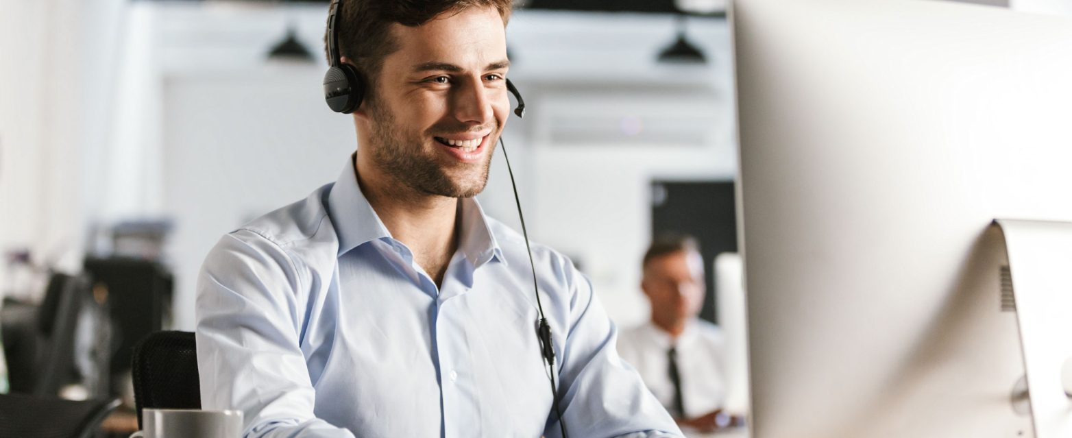 photo-businesslike-man-20s-wearing-office-clothes-headset-working-computer-call-center