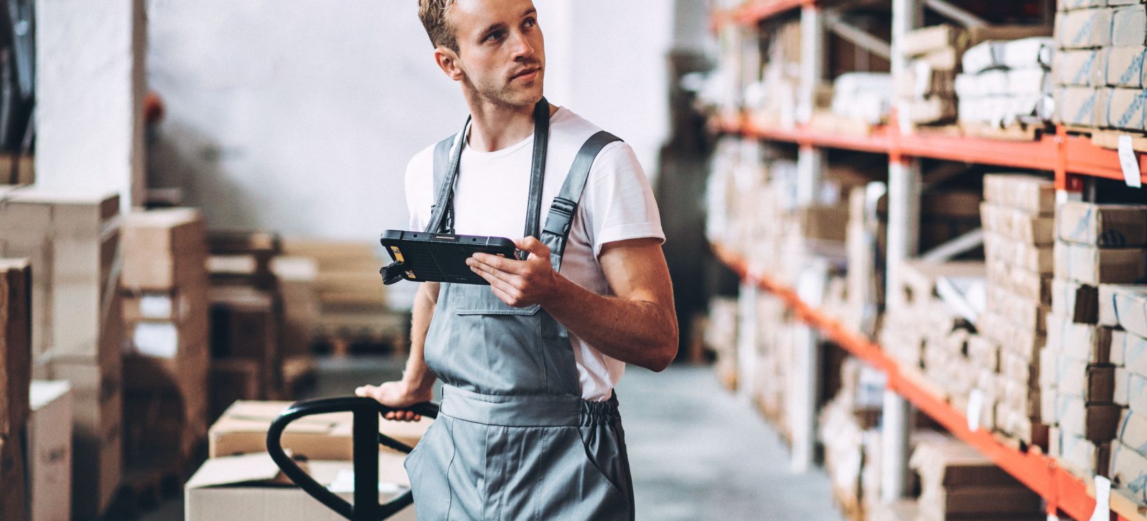 young-man-working-warehouse-with-boxes